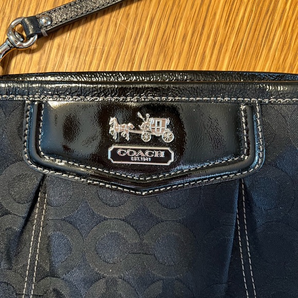 Black Coach clutch with zipper and one inside pocket. - Picture 2 of 9